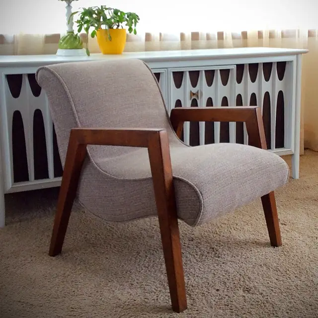 Mid-century armchair with wood arms, re-covered in an oatmeal fabric